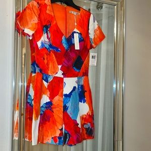 Trina Turk multi color romper, has pockets. Its a size 0 but runs big(2-4)